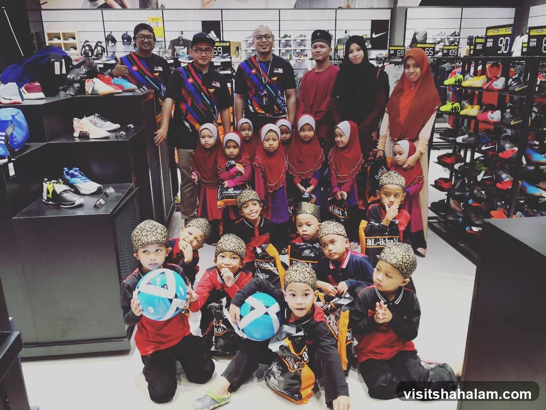 Group of children and adults in a sporting goods store