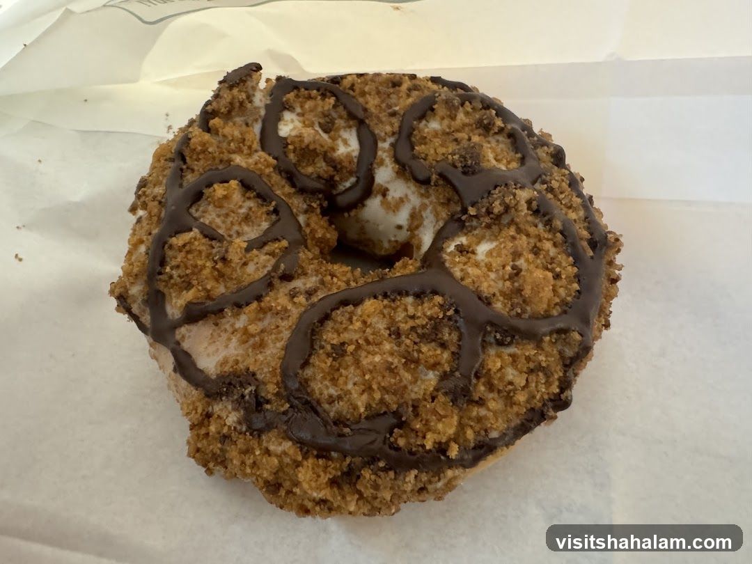 Donut with Chocolate Drizzle and Crumble Topping