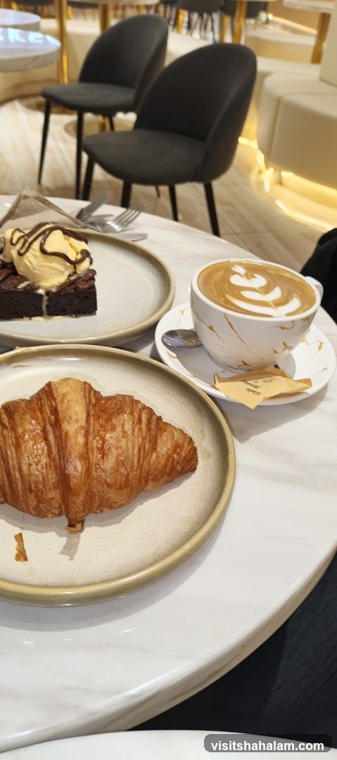 Cafe Table with Pastries and Coffee
