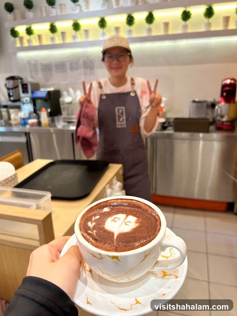 Barista serving a drink