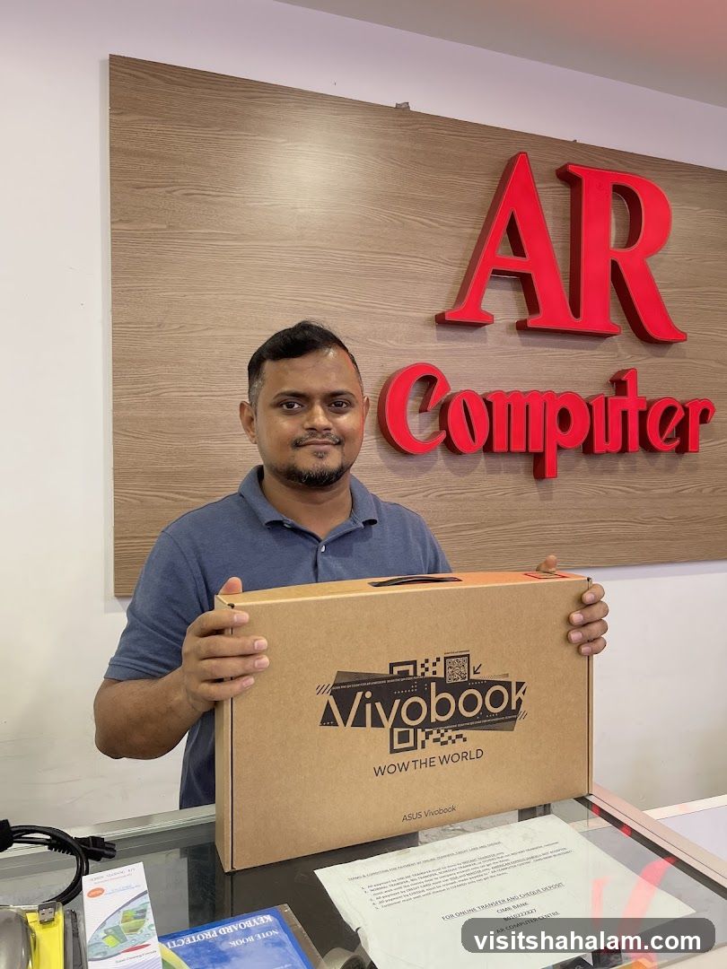Man holding a Vivobook laptop box