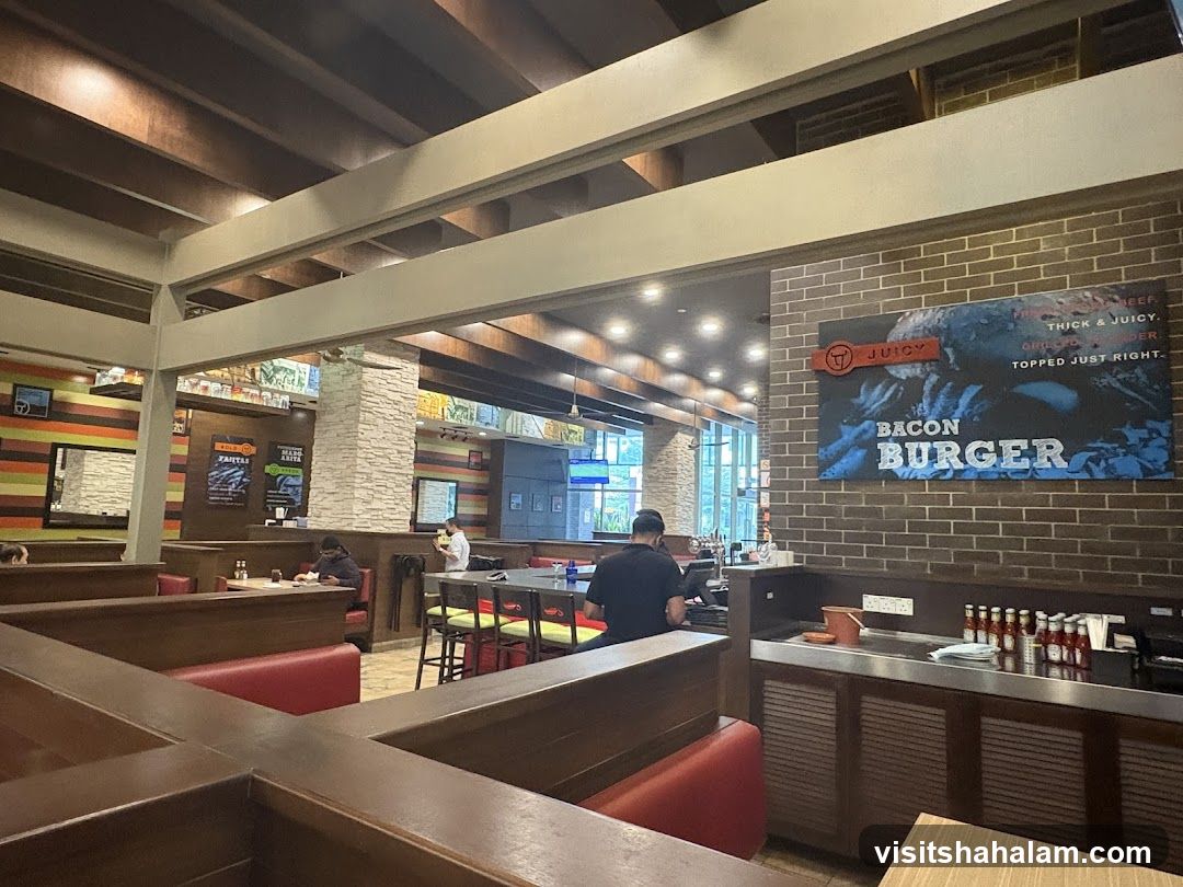 Restaurant Interior with Bacon Burger Advertisement