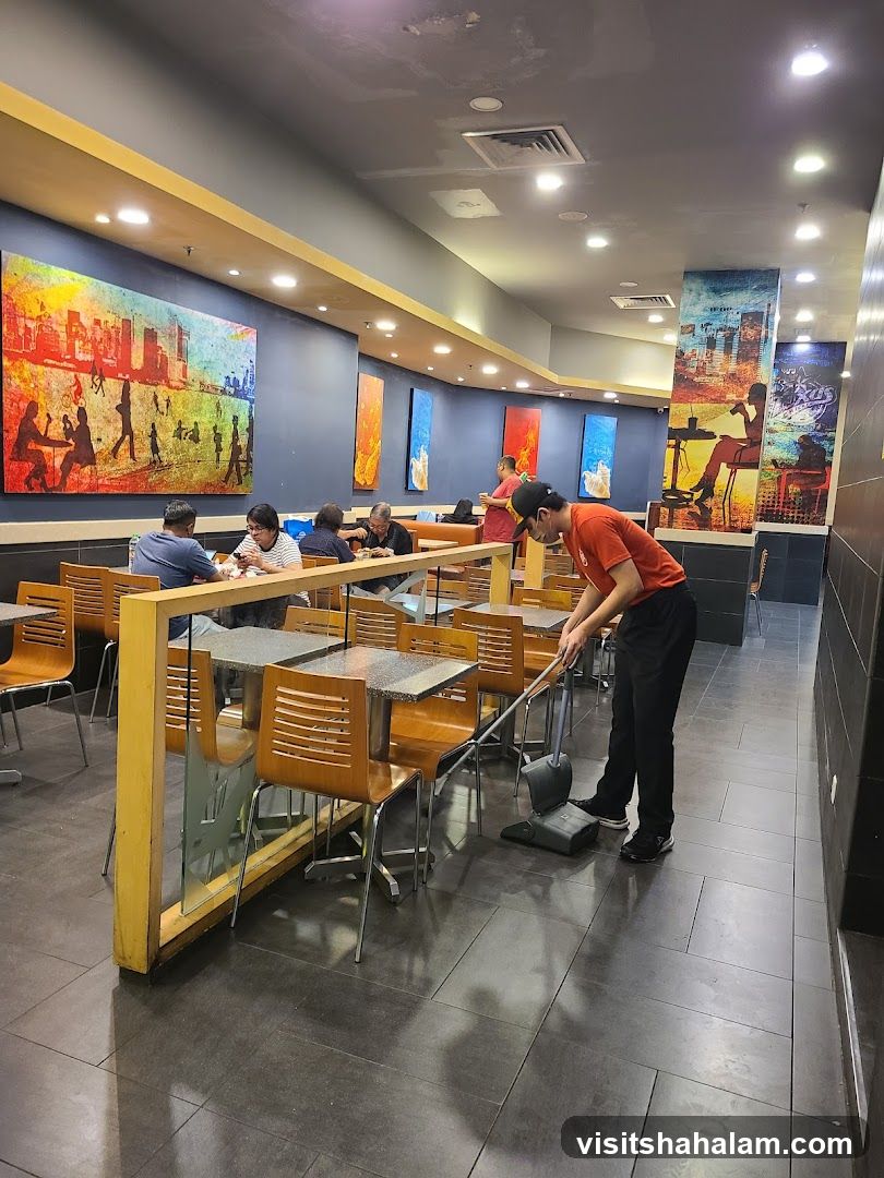Restaurant Interior with Staff Cleaning