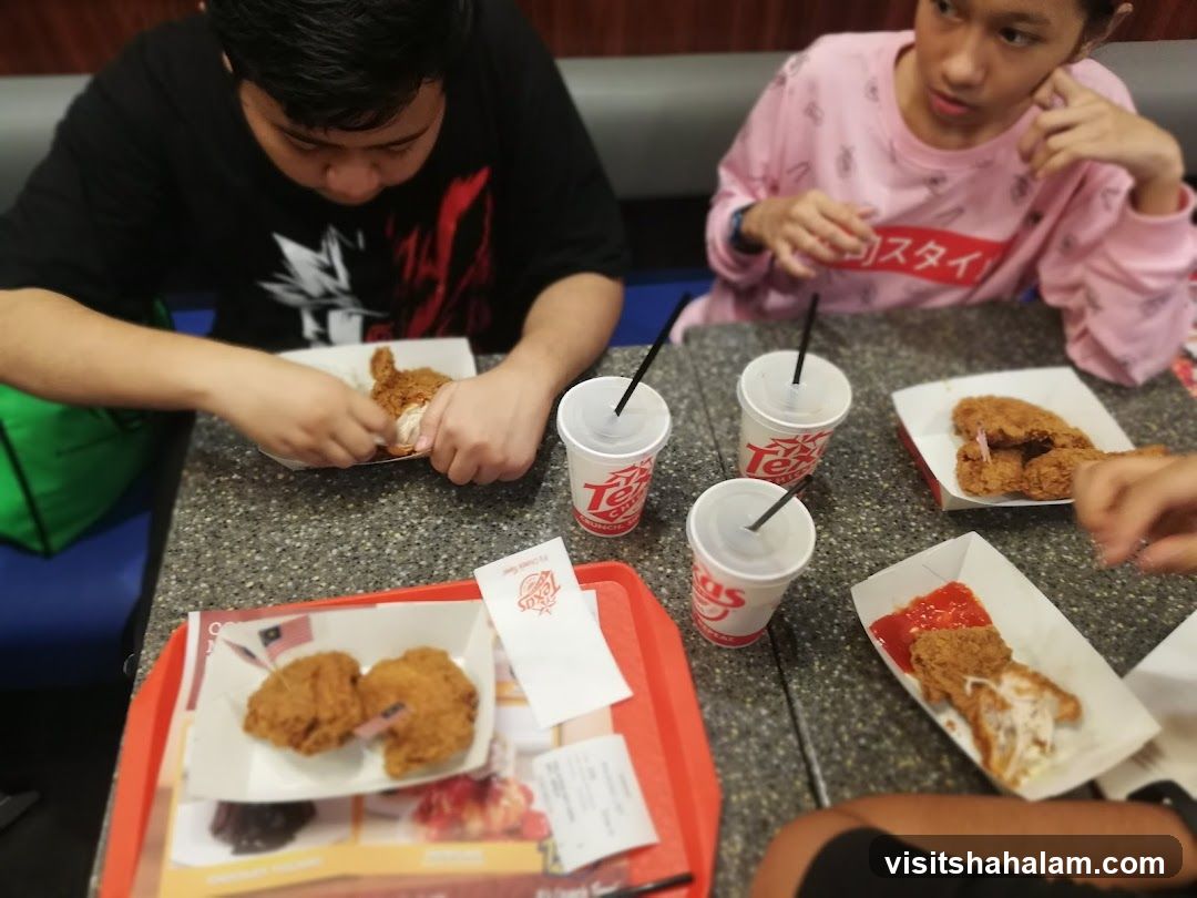 People eating fried chicken