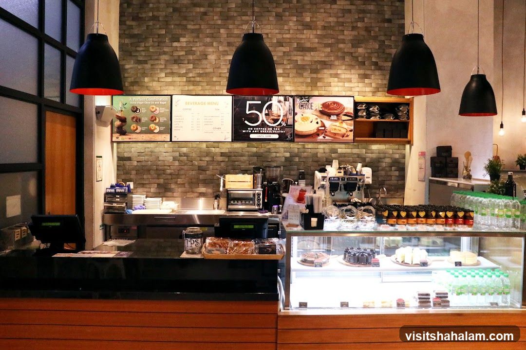 Cafe Counter with Pastries and Drinks