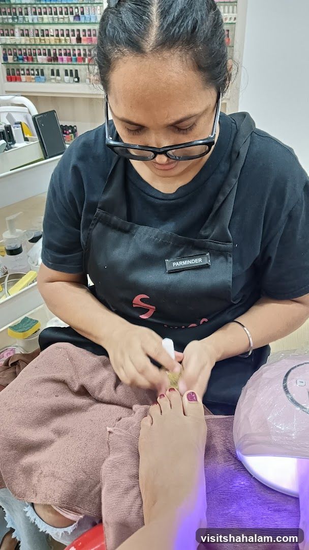 Nail Technician Performing Pedicure