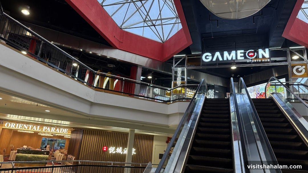 Mall Interior with Escalators and Storefronts