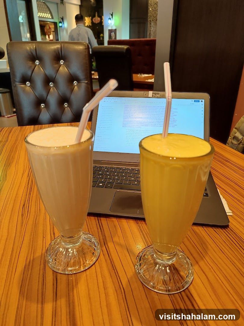 Drinks and Laptop on Table