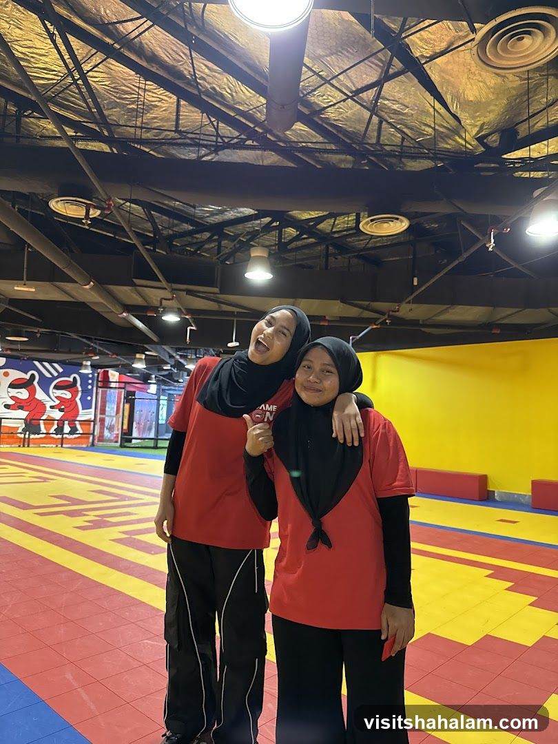 Two smiling women in red shirts