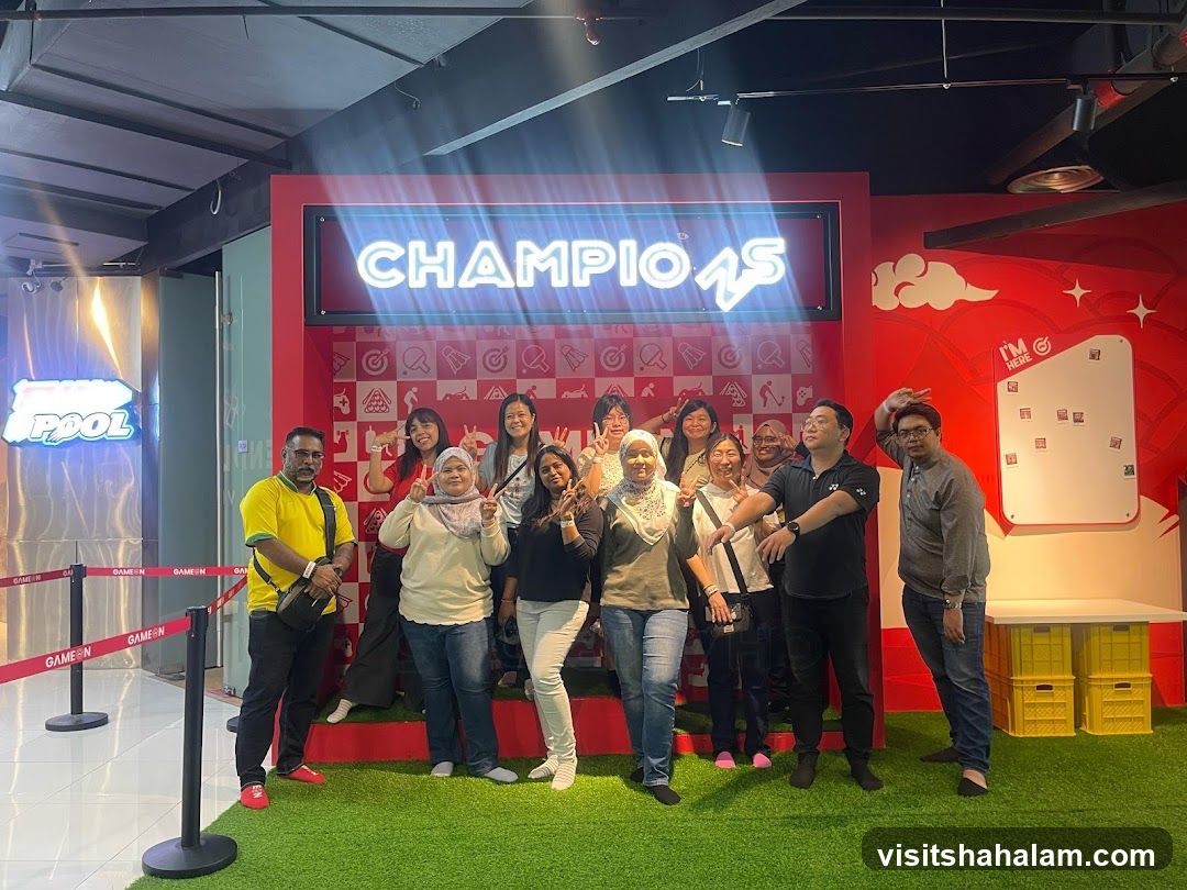 Group Posing in Front of Champion Sign
