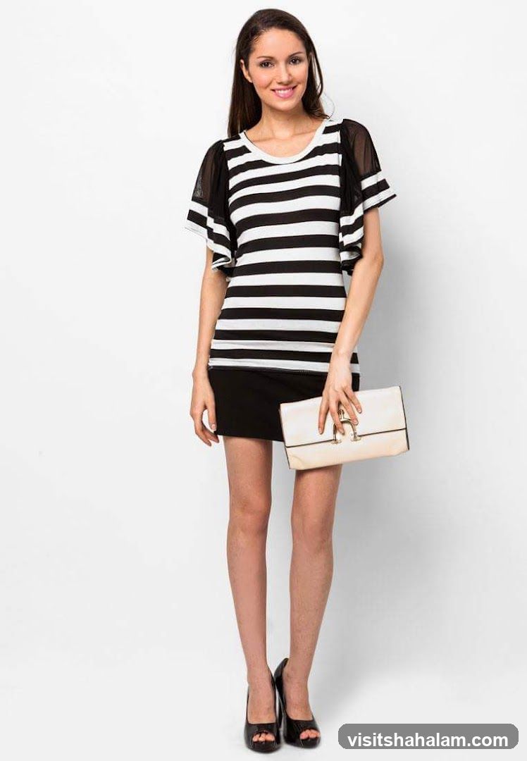 Woman in striped dress and black skirt