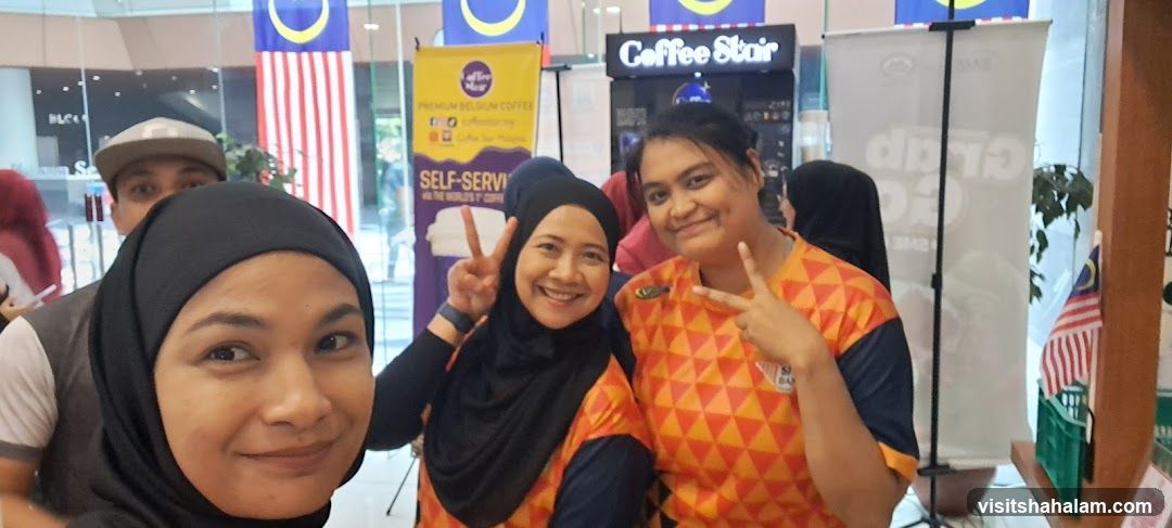 People Posing at a Coffee Booth