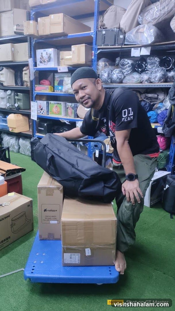 Man with boxes and bag on cart