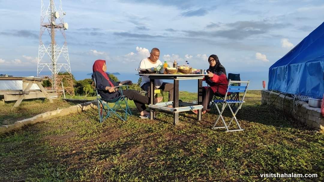 People having a picnic on a hilltop