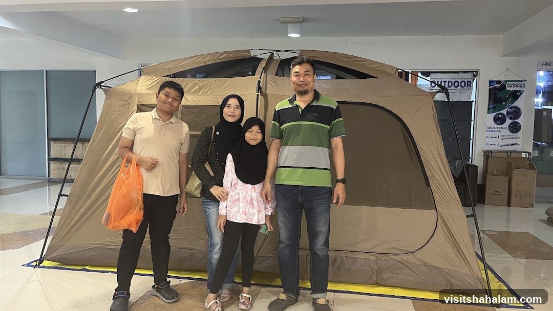 Family Poses in Front of a Tent