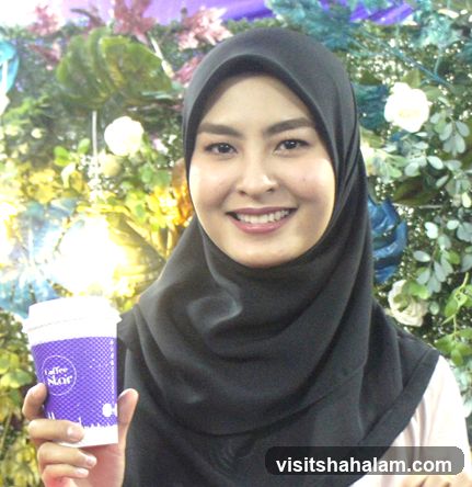Woman holding a coffee cup