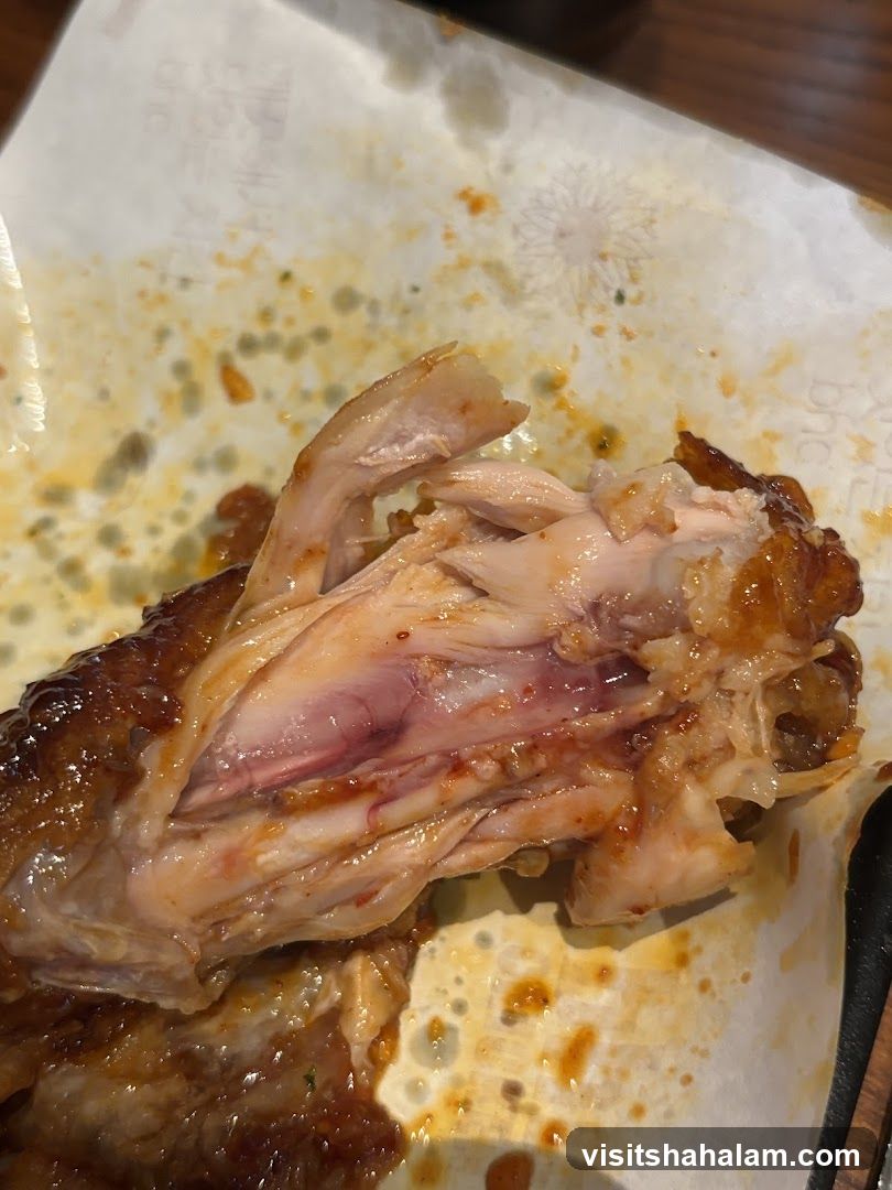 Close-up of a cooked chicken wing