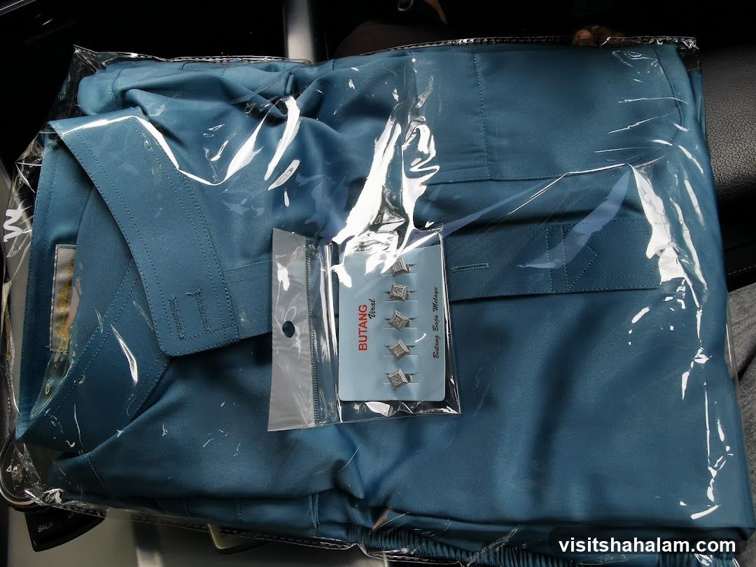 Packaged Teal Garment with Accessories