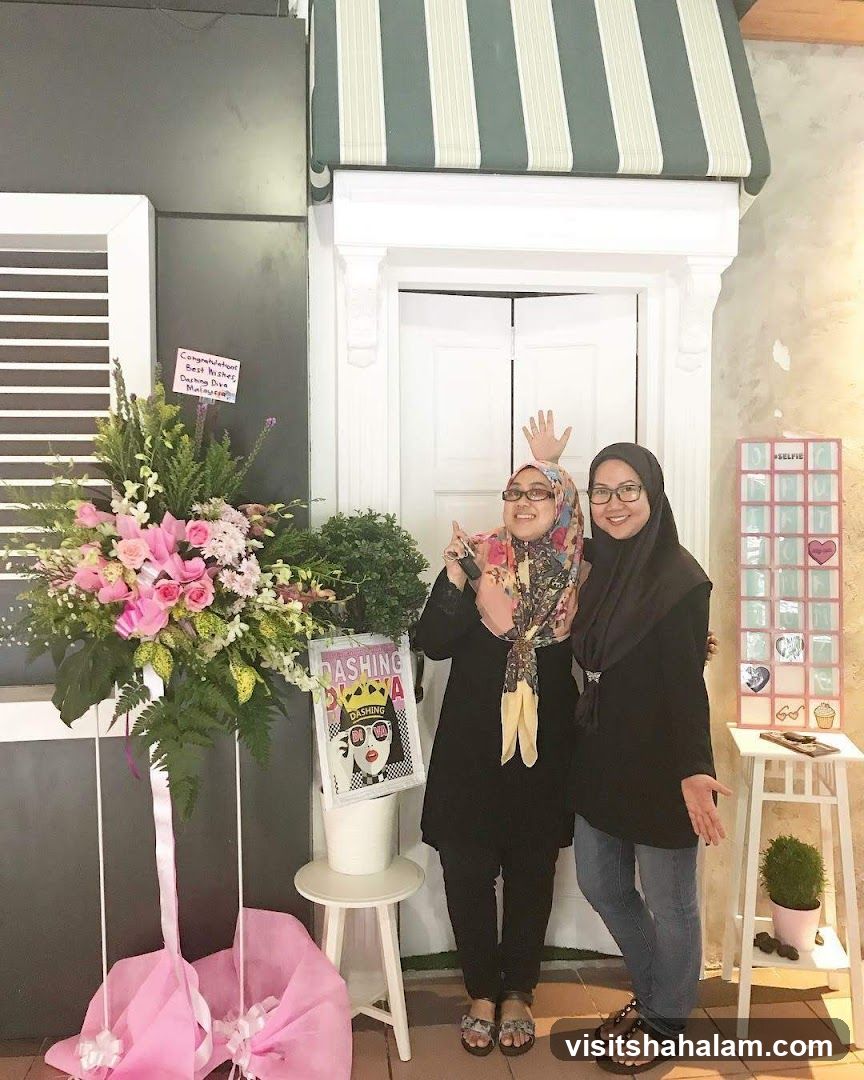 Two Women Posing in Front of a Decorated Doorway