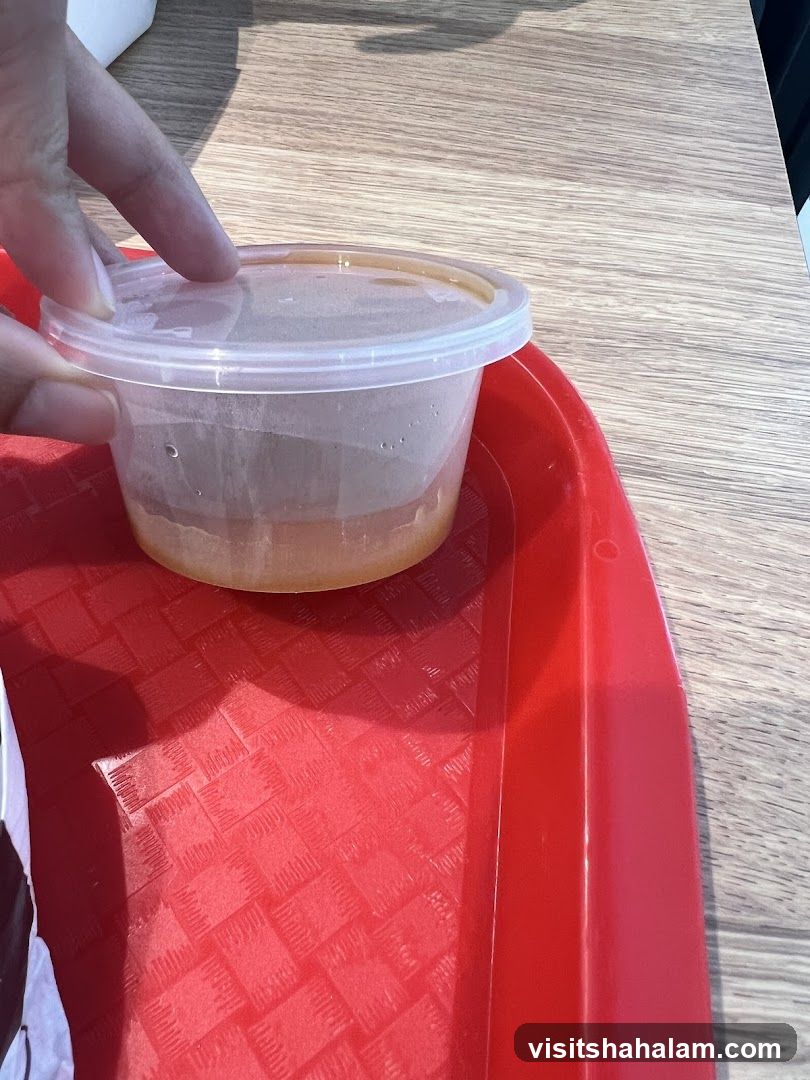 Sauce container on a tray