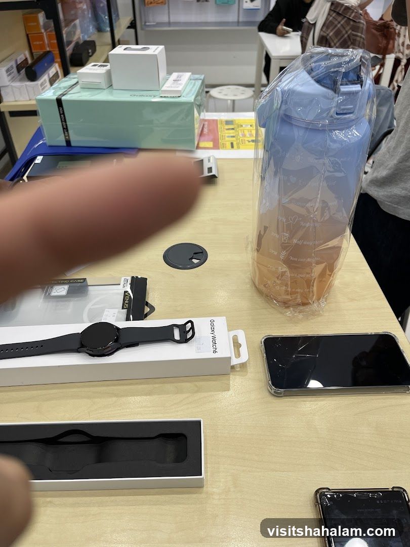 Table with electronics and water bottle