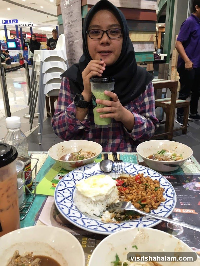 Woman drinking a beverage at a restaurant