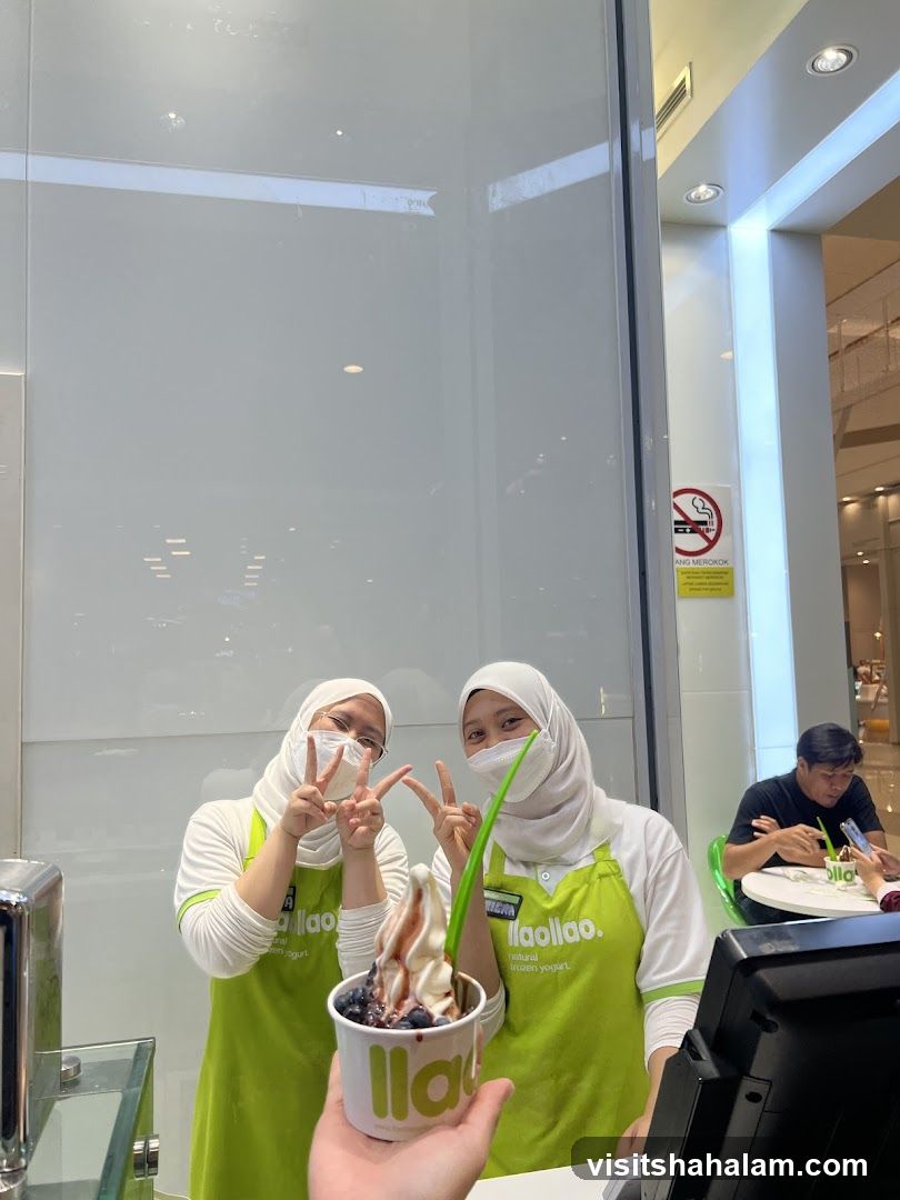 Staff holding a frozen yogurt cup
