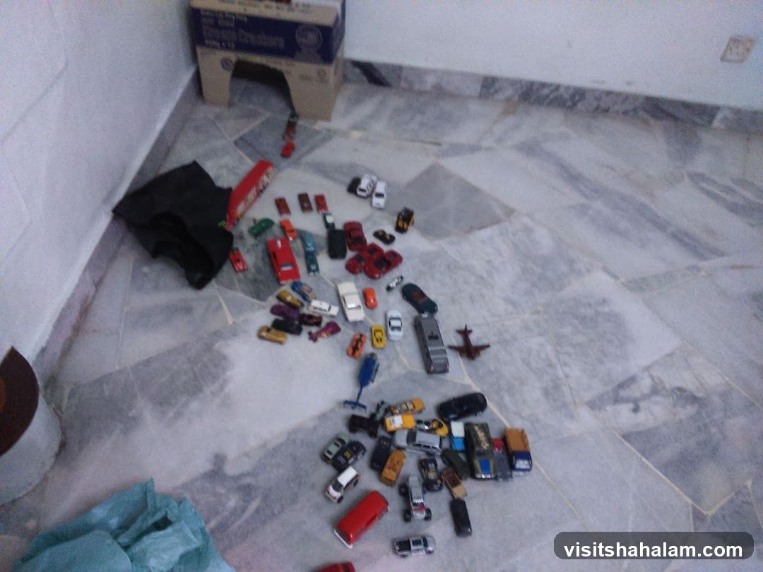 Toy Cars and Airplane on Floor
