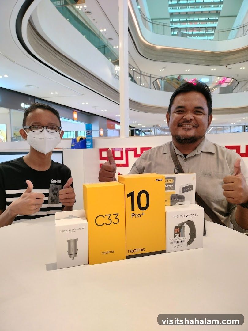 Two men with Realme products