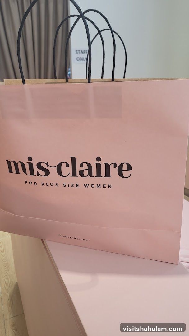 Pink shopping bag with "mis claire" logo