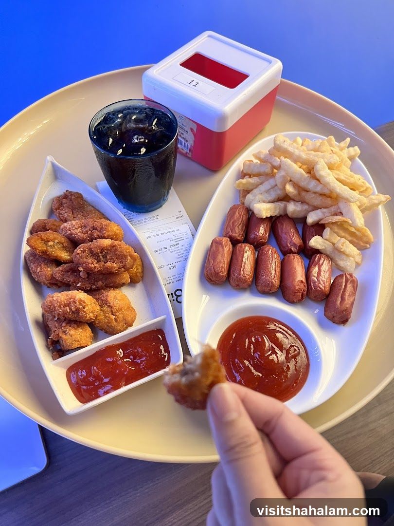 Meal with Chicken Nuggets, Mini Sausages, and Fries