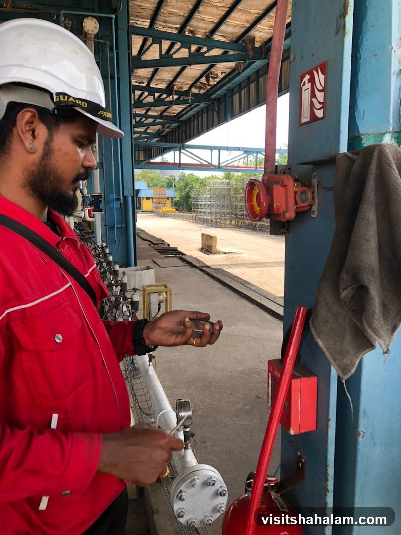 Industrial worker inspecting equipment
