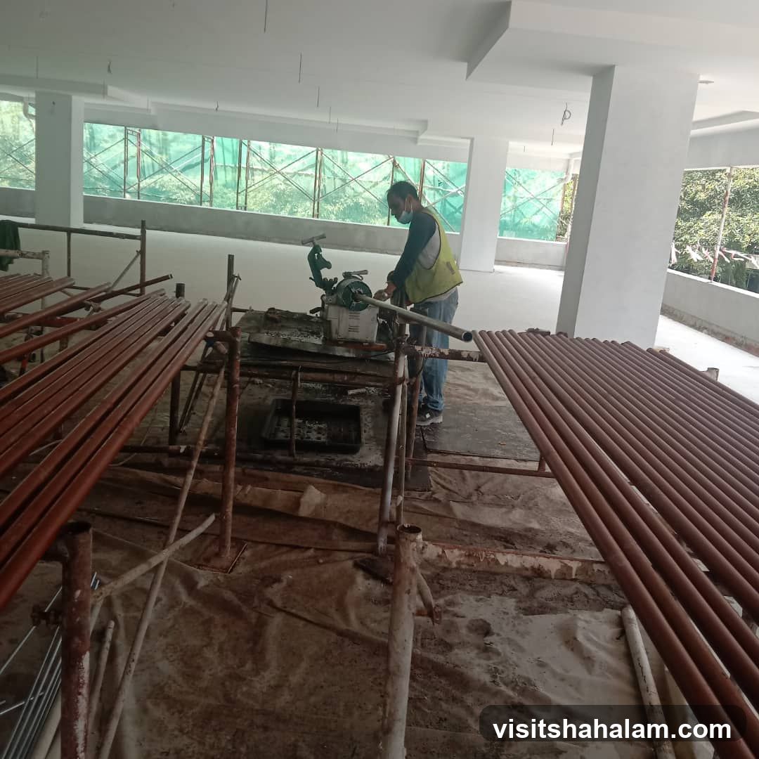 Construction Worker Operating Pipe Threading Machine