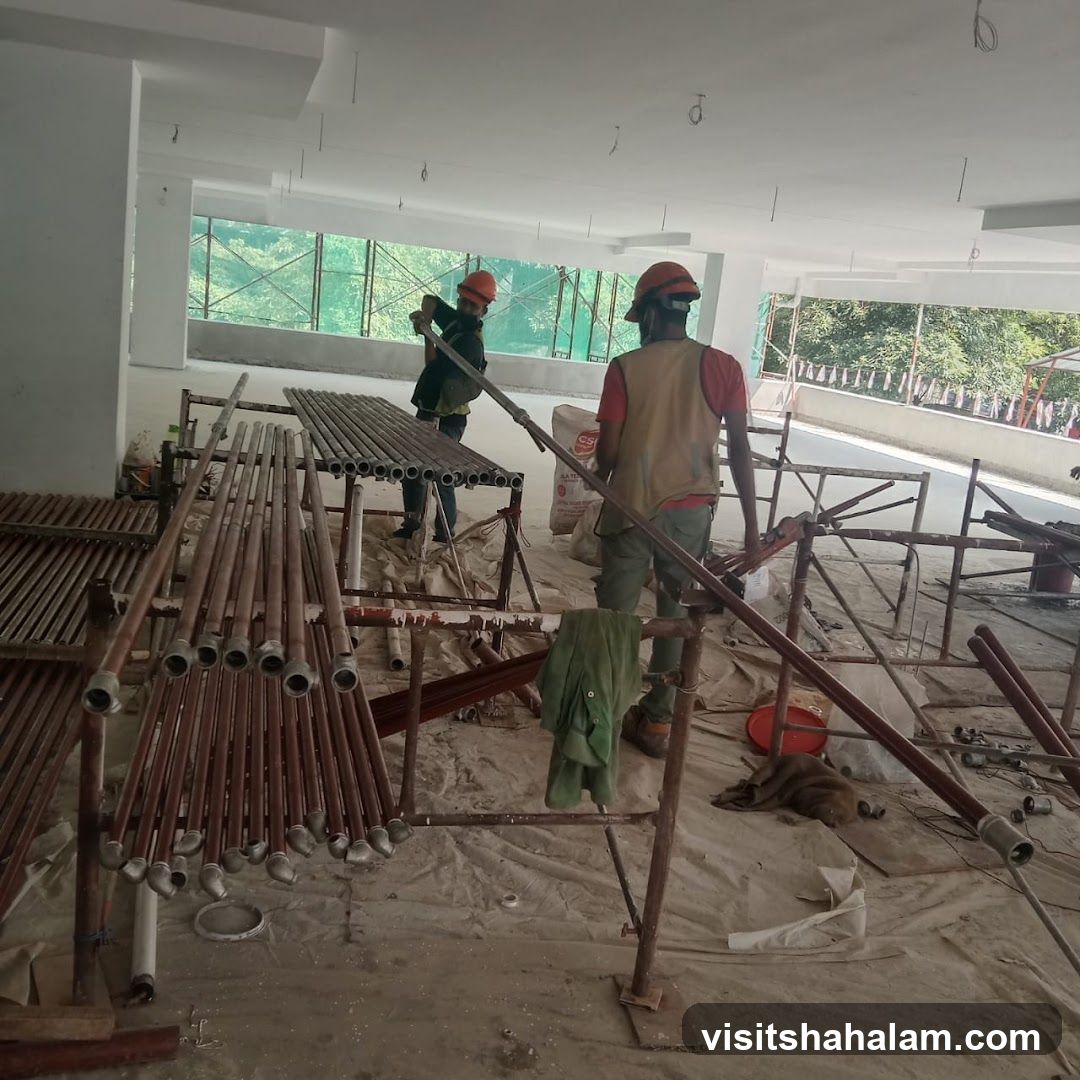 Construction workers assembling scaffolding