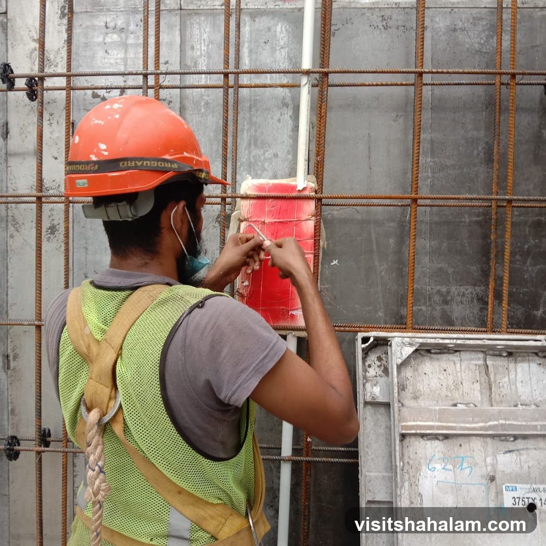 Construction worker tying rebar