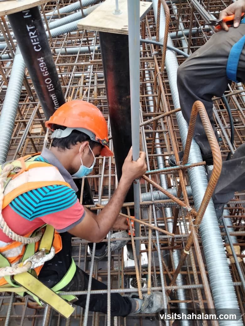 Construction workers installing conduit