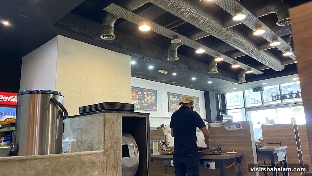 Restaurant Interior with Staff Cooking