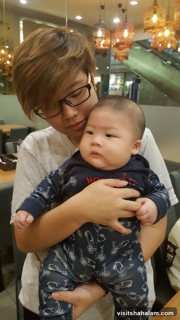 Person holding a baby
