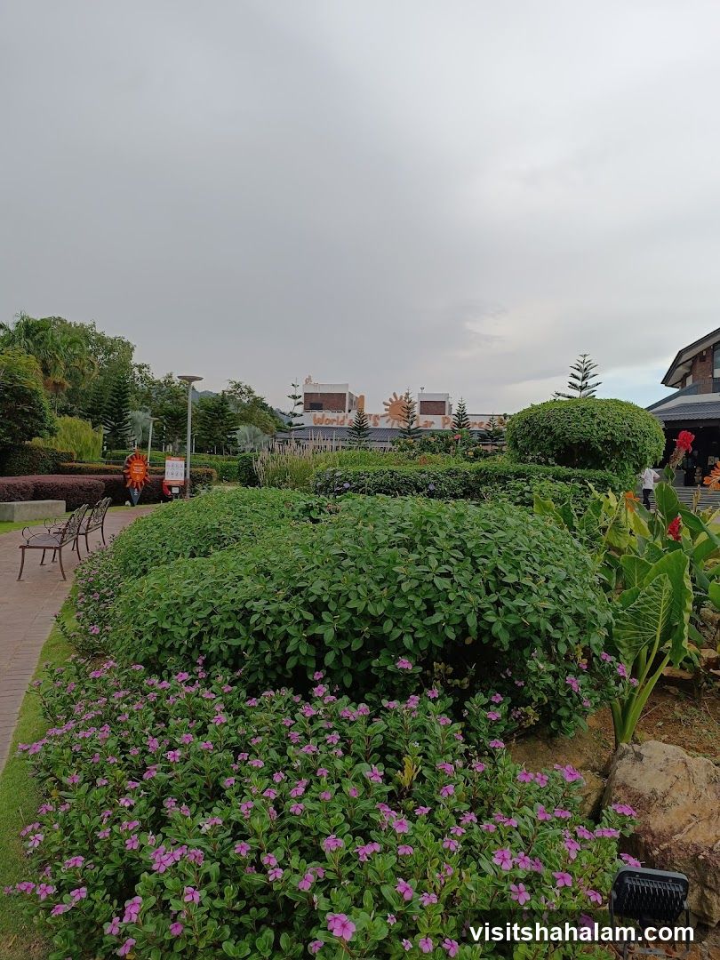 Landscaped Garden with Buildings in Background