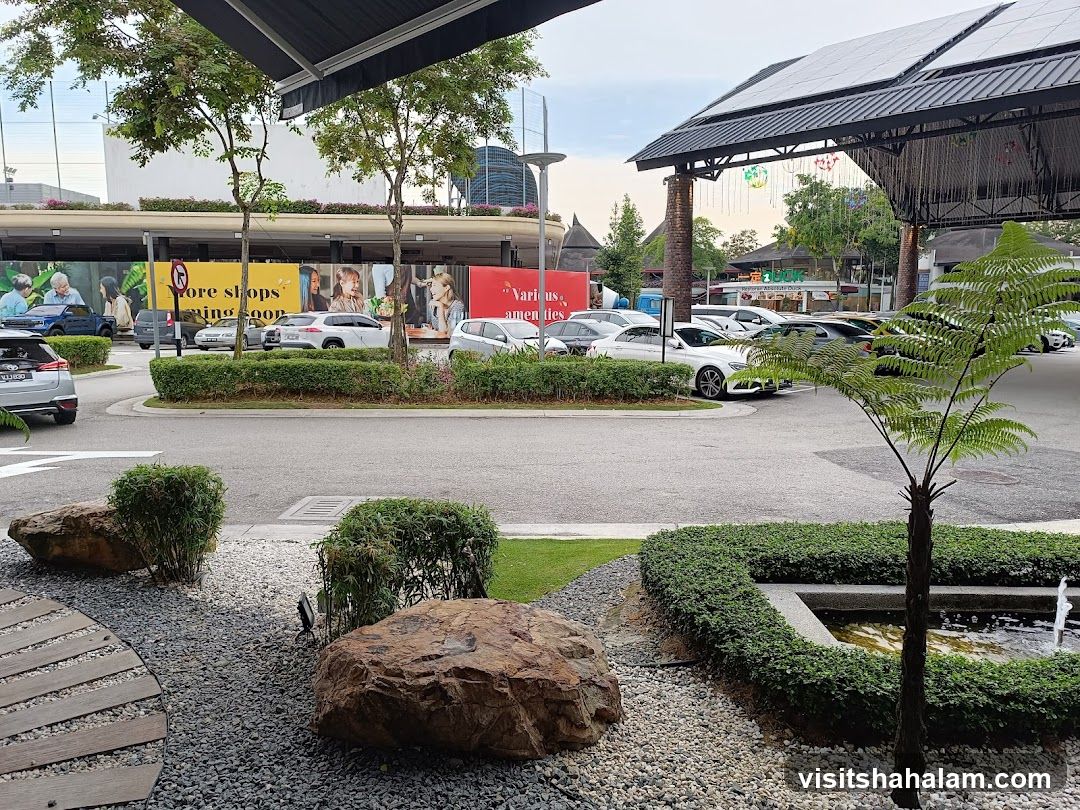 Outdoor shopping area with parking and landscaping