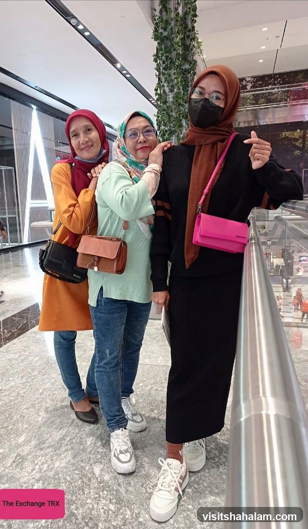 Three women posing for a photo