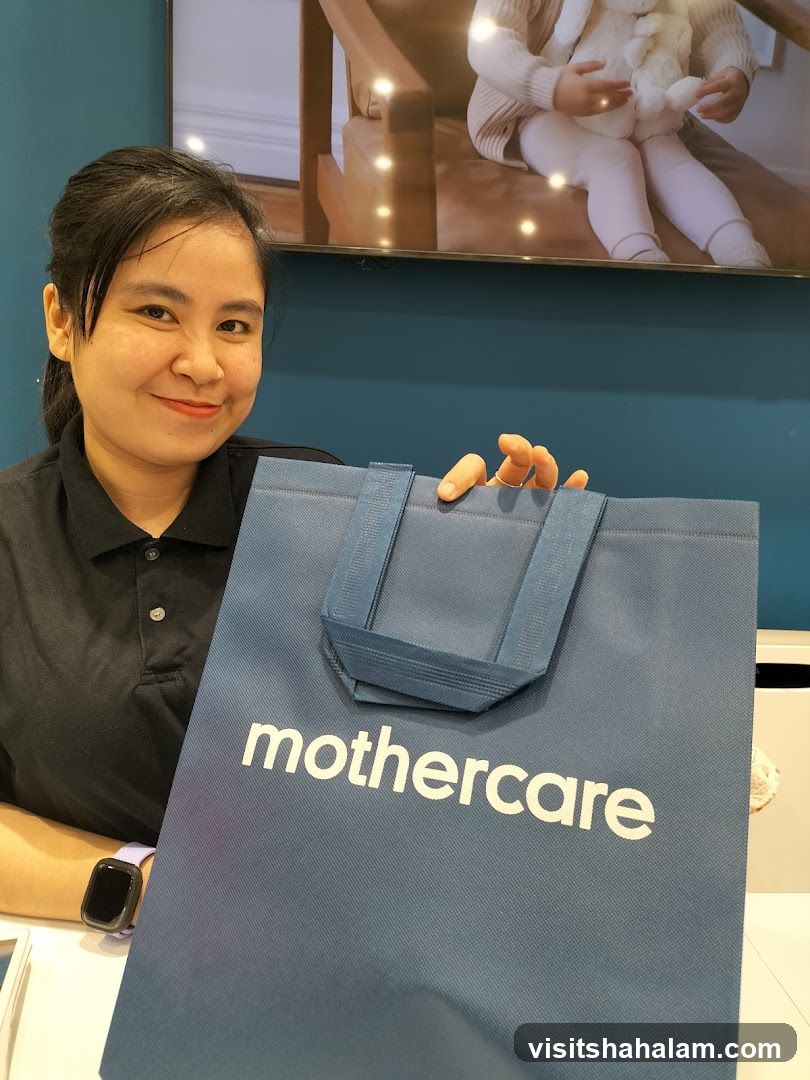 Woman holding a Mothercare bag
