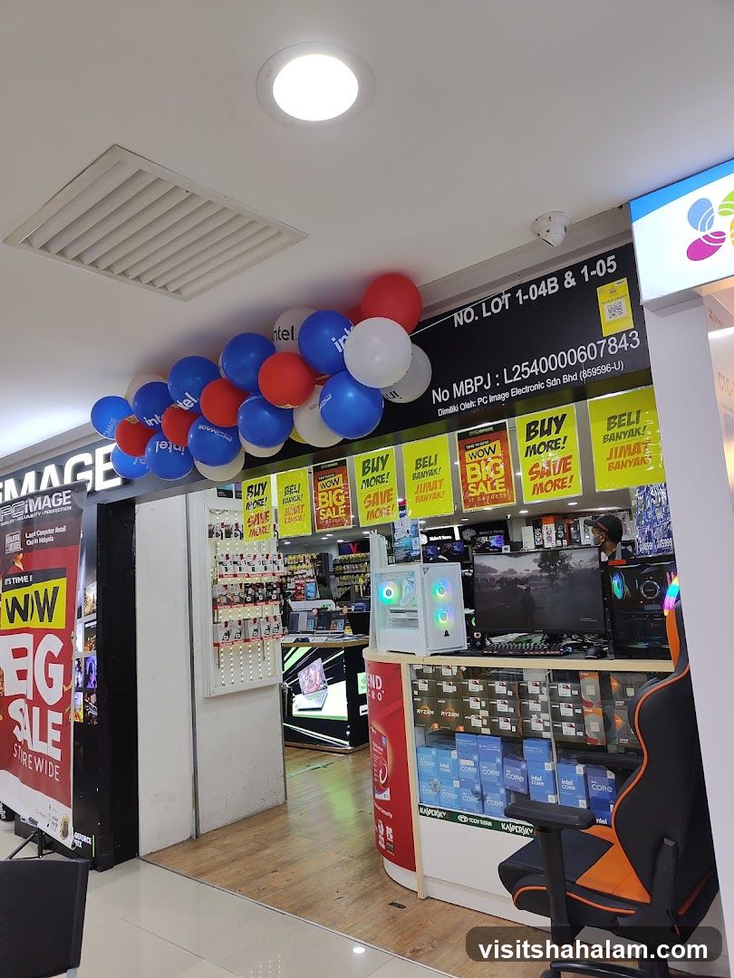 Computer store with sale banners and balloons