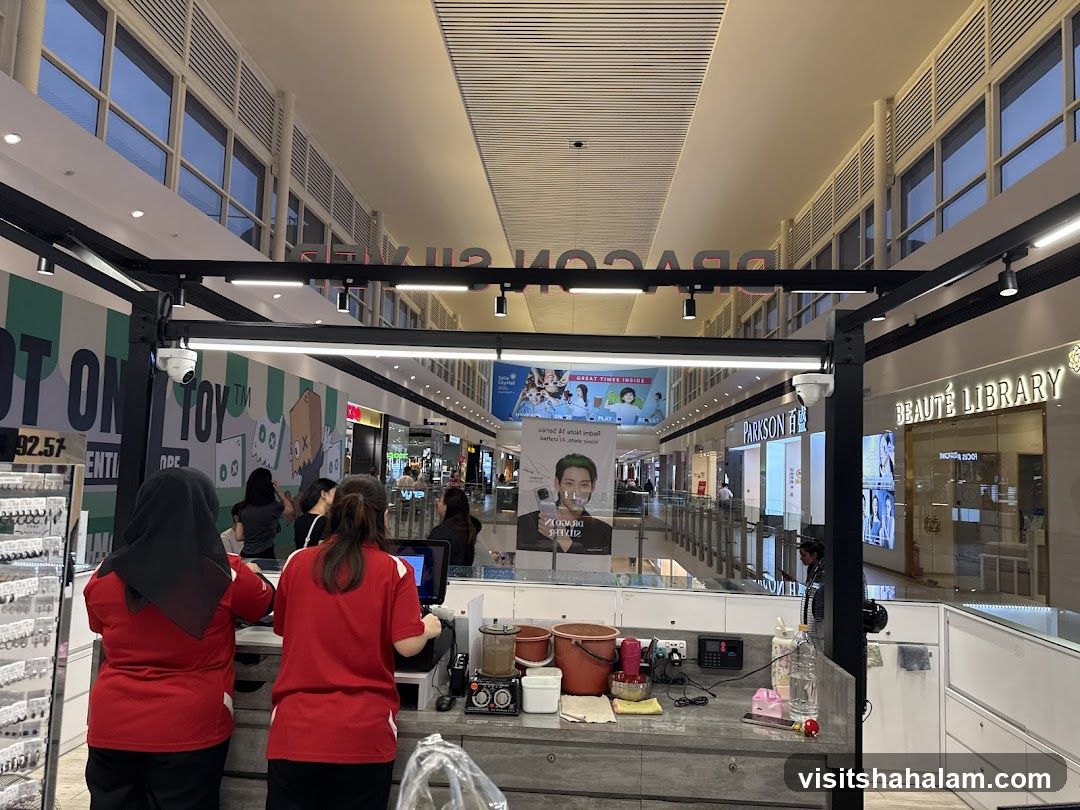 Mall Interior with Shops and Staff