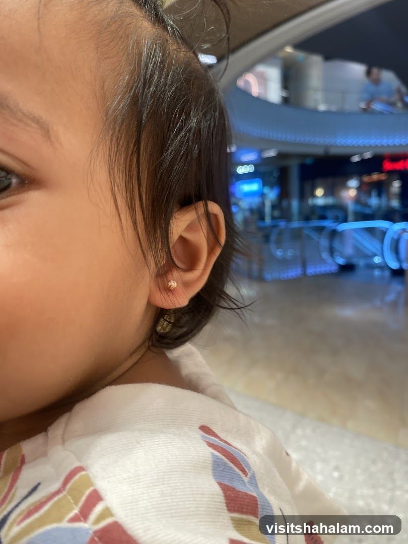 Close-up of a child's ear with an earring