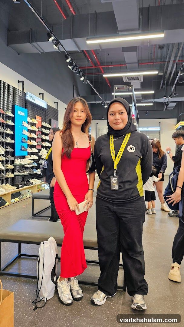 Two women posing in a shoe store