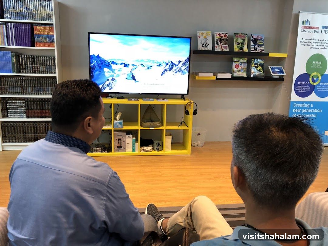 People watching TV in a library