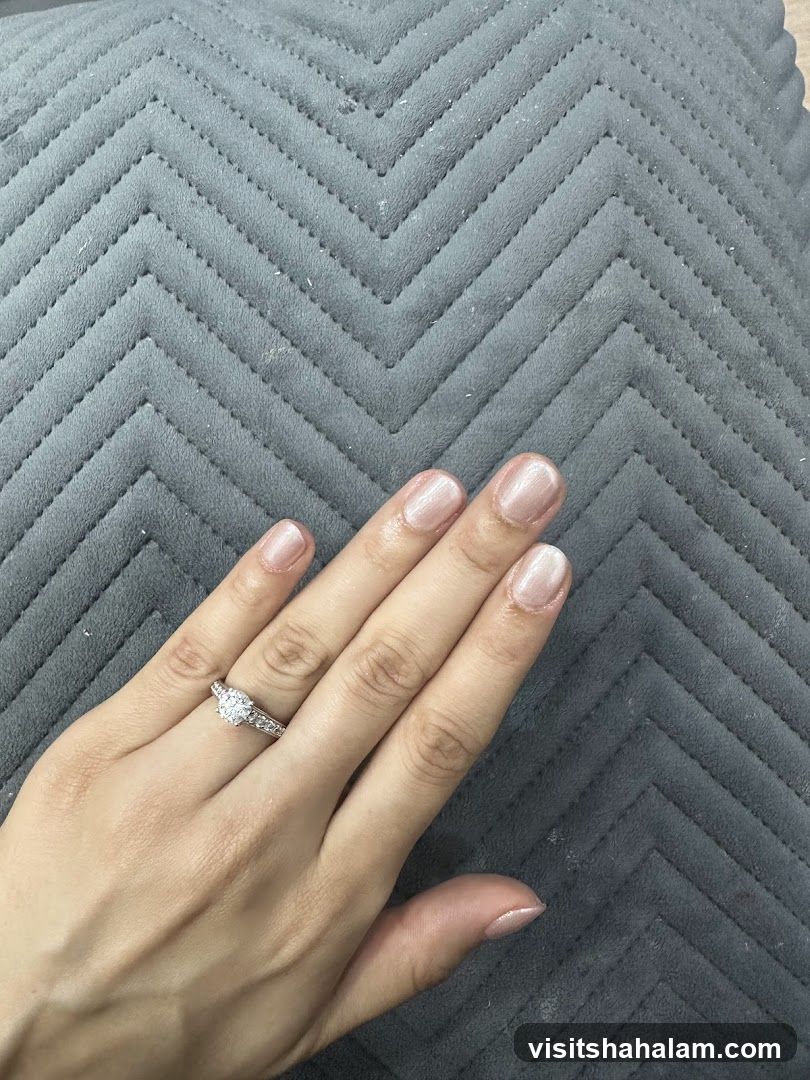Woman's Hand with Ring and Manicure