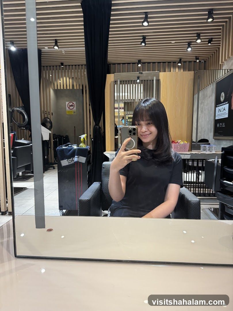 Woman taking a selfie in a salon