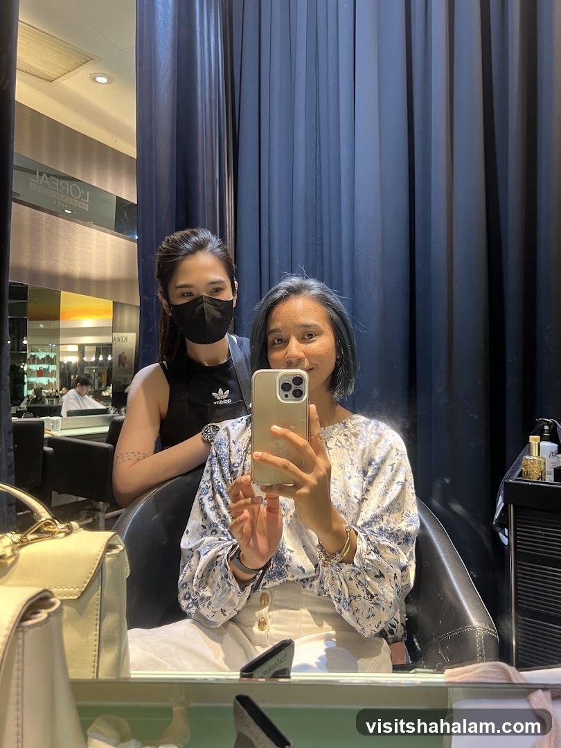 Two Women Taking a Mirror Selfie in a Salon
